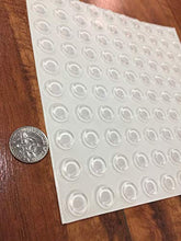 Load image into Gallery viewer, Pack of 100 Cabinet Door Bumpers - 1/2” Diameter Clear Adhesive Pads for Drawers, Glass Tops, Cutting Boards, Picture Frames, Small Furniture