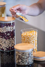Load image into Gallery viewer, Glass Food Storage Containers with Lids by Sweetzer and Orange - Set of 4 Kitchen Canisters - Candy, Cookie, Rice and Spice Jars - Sugar or Flour Container - Big and Small Airtight Food Jar for Pantry